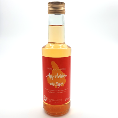 en flaska orangegul äppelcidervinäger